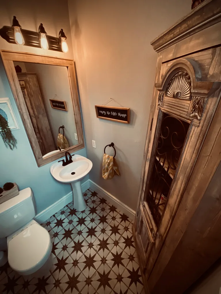 Photo after flooring installation of a star pattern tile in a half bathroom